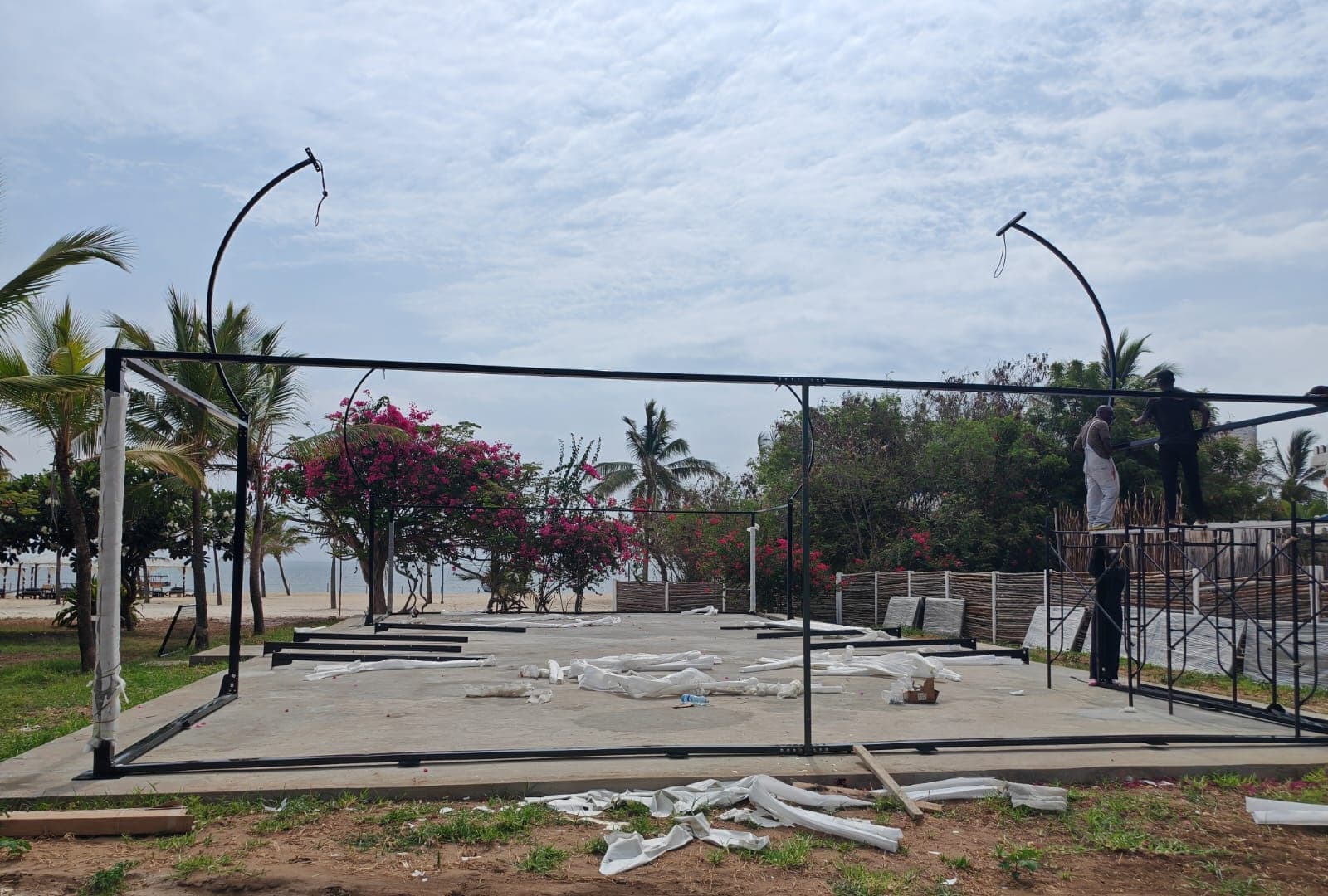 The frame goes up, right by the beach.